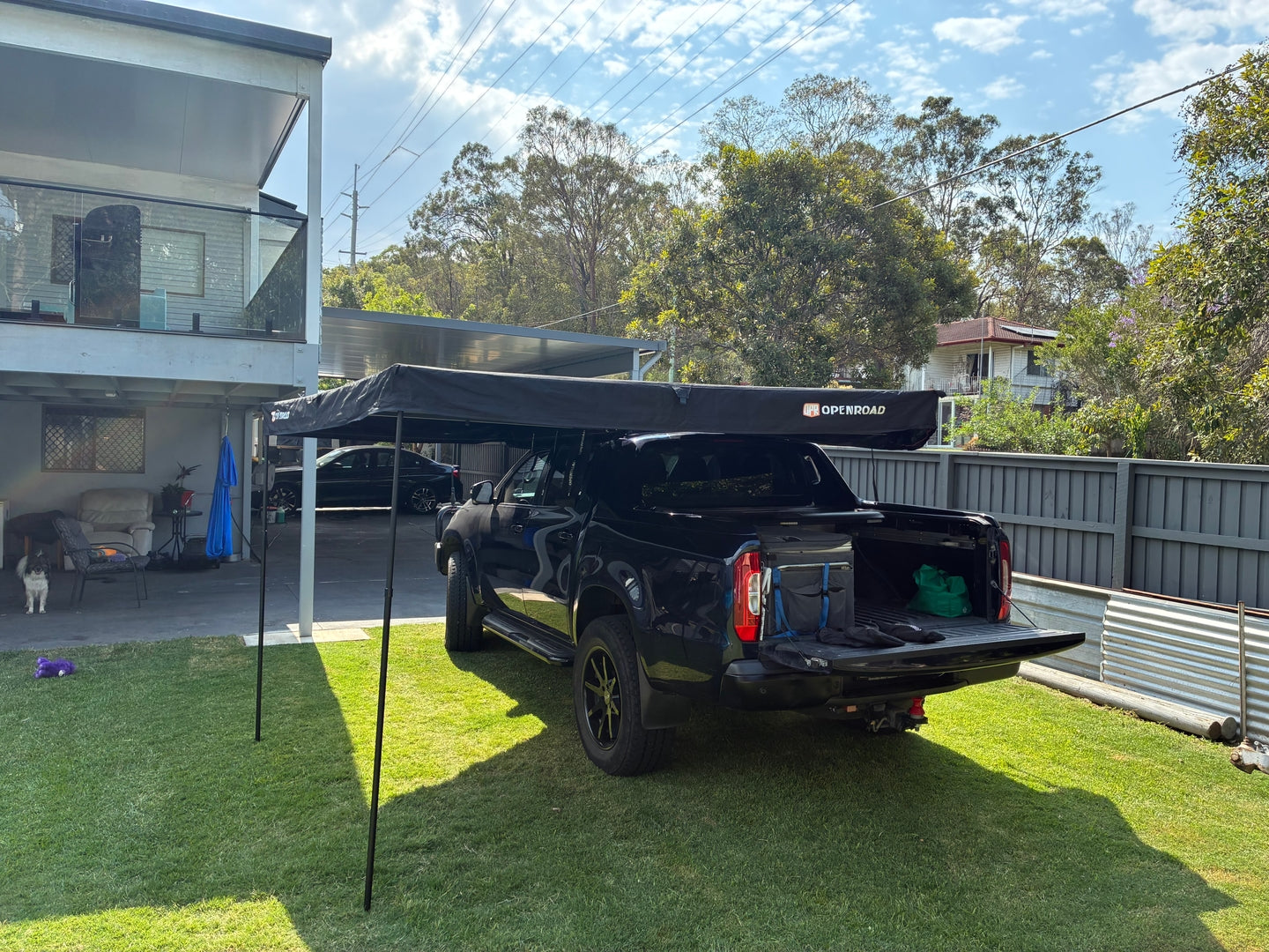 Isuzu D-MAX 2021 fitted with an OPENROAD 270 awning, creating wide side and rear shade at a bush campsite.