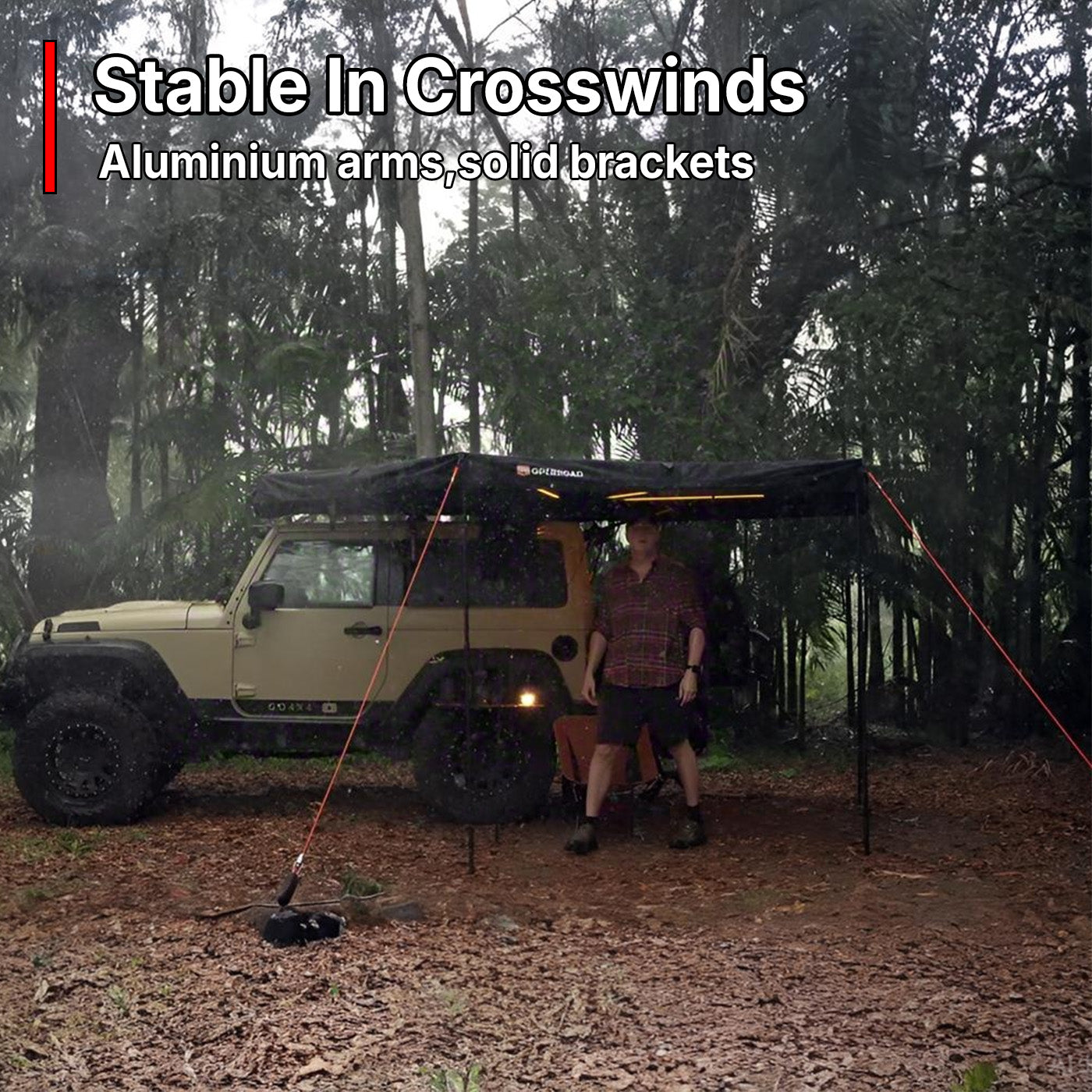 OPENROAD 270° awning in heavy rain—aluminium arms and tie-downs for stable coverage
