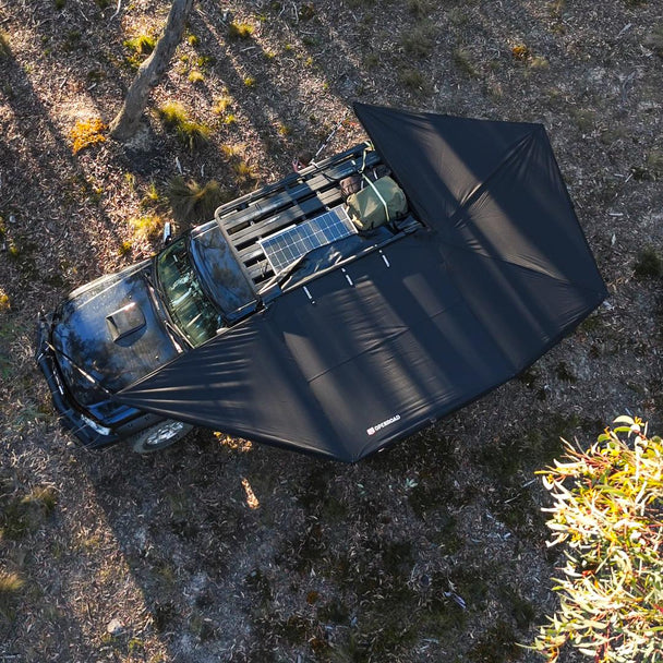 Roof-rack mounted OPENROAD 270-degree car awnings plus covering side and rear; overland setup with solar panel