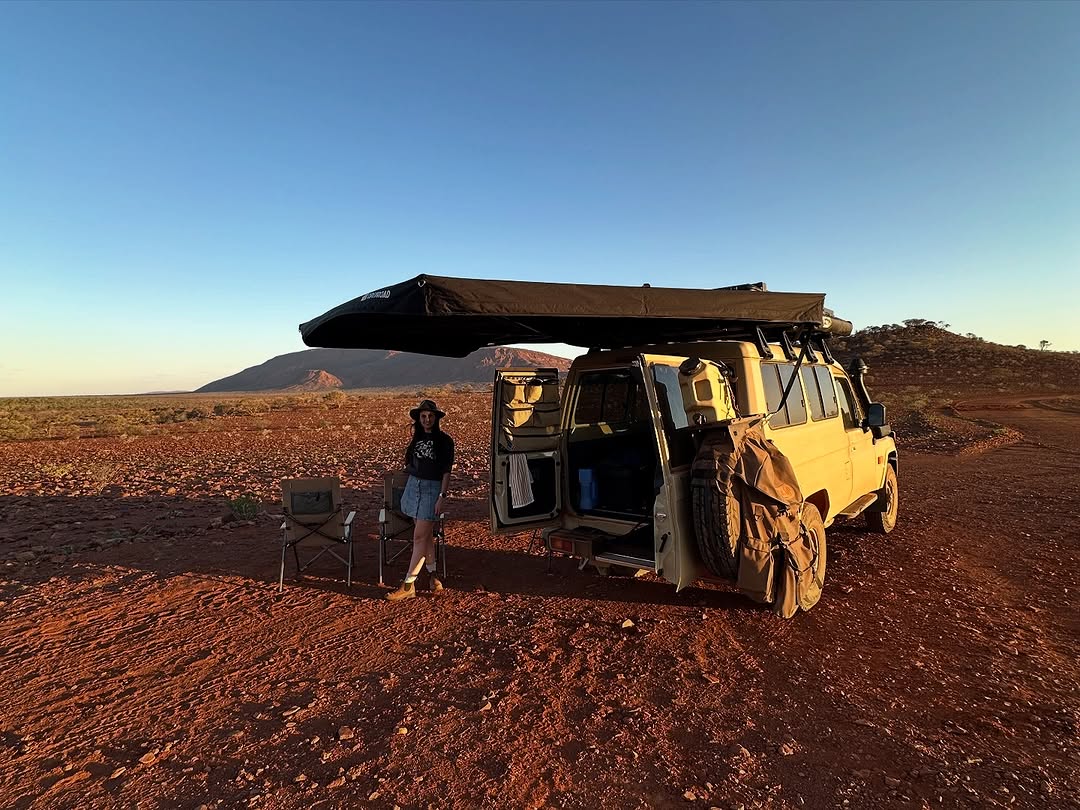 OPENROAD 270 degree awning on a 4WD touring wagon, wrap-around shade at an outback campsite during golden hour
