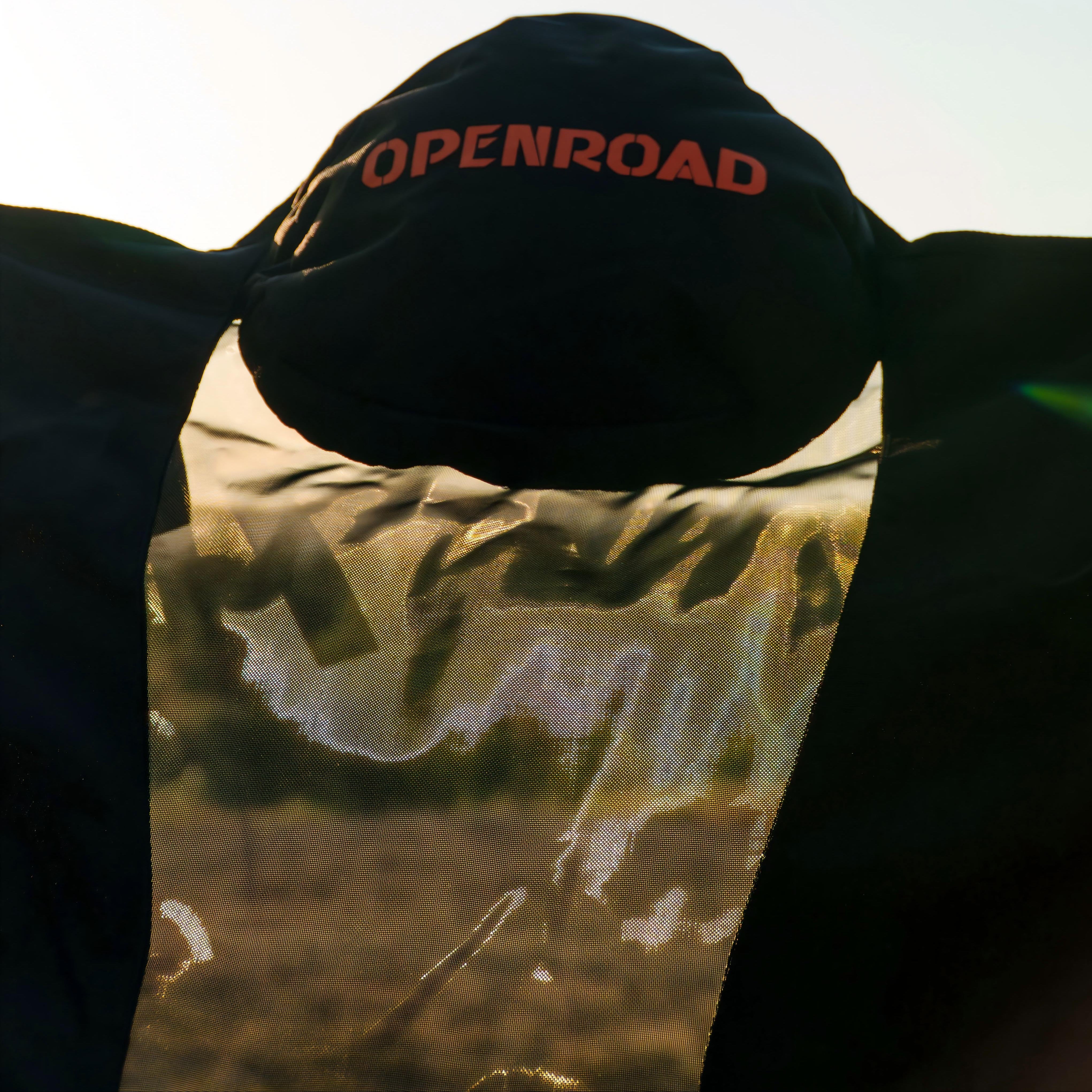 OPENROAD camping chair with padded headrest and breathable mesh back panel at sunset