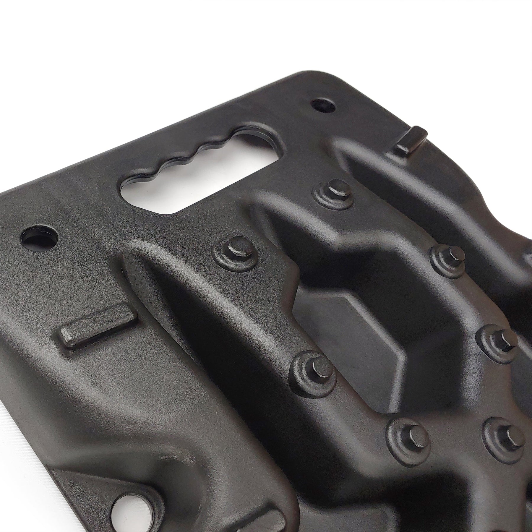 Close-up of Openroad recovery board featuring ergonomic carry handle and aggressive traction spikes for superior tire grip