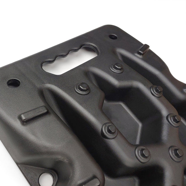 Close-up of Openroad recovery board featuring ergonomic carry handle and aggressive traction spikes for superior tire grip