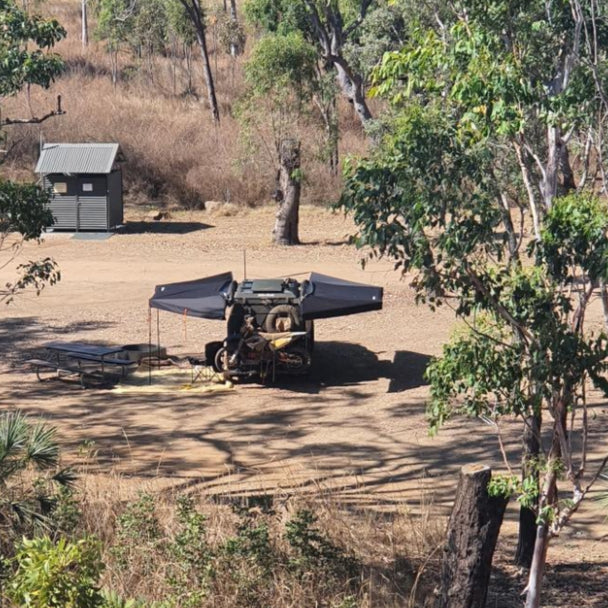 Openroad dual 180° car awnings mounted on a 4WD, creating wide shade coverage for camping.