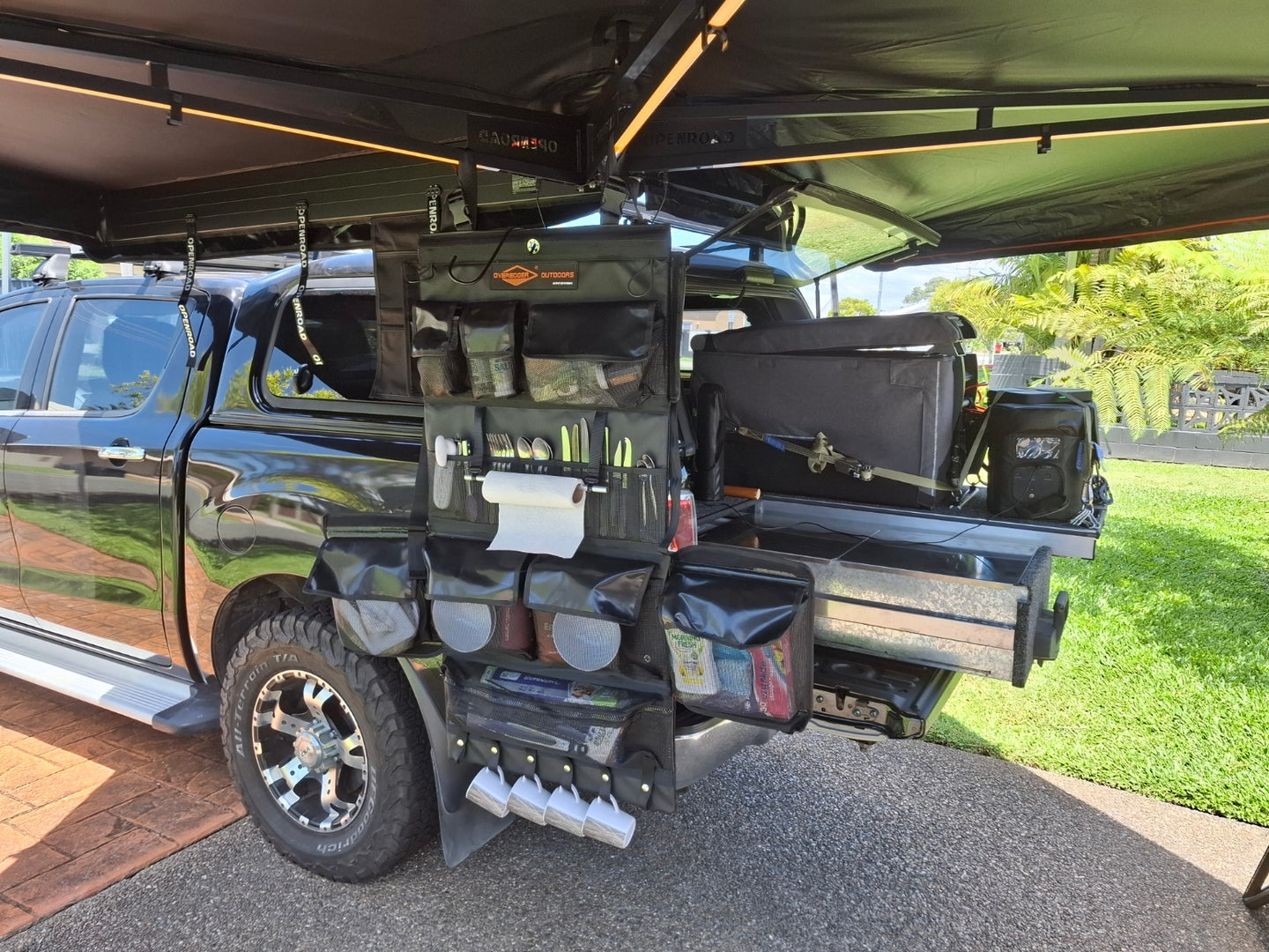 Side view of an Openroad freestanding awning on a 4WD ute, providing wide shade for camping and everyday utility.