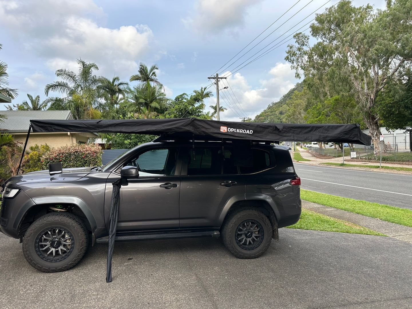 Toyota LandCruiser 300 Series fitted with an Openroad 270 degree awning, showing full side shade coverage for 4WD touring and camping